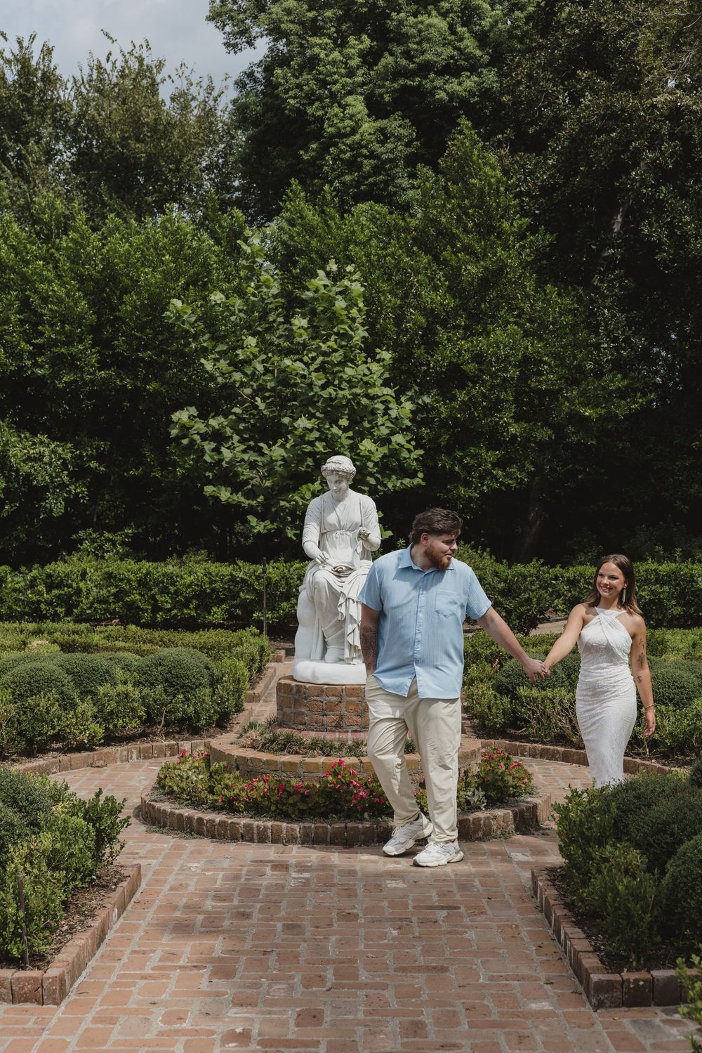Couple during their romantic engagement session at Bayou Bend Collection and Gardens in Houston, Texas.