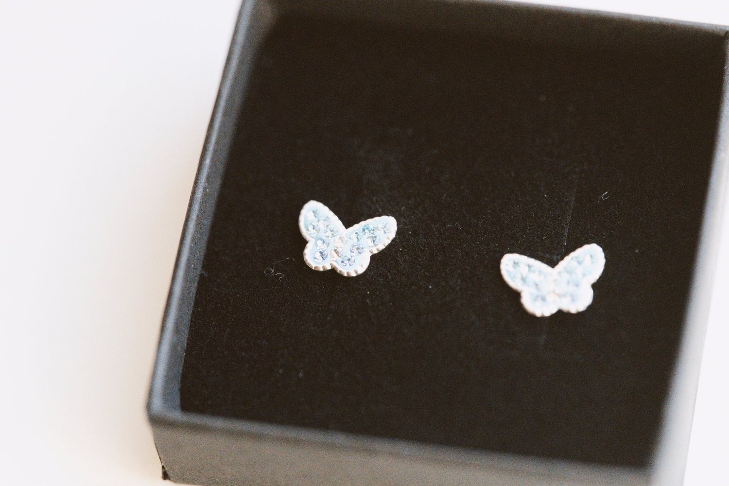 Butterfly stud earrings in a gift box, Sandhole Oak Barn wedding morning