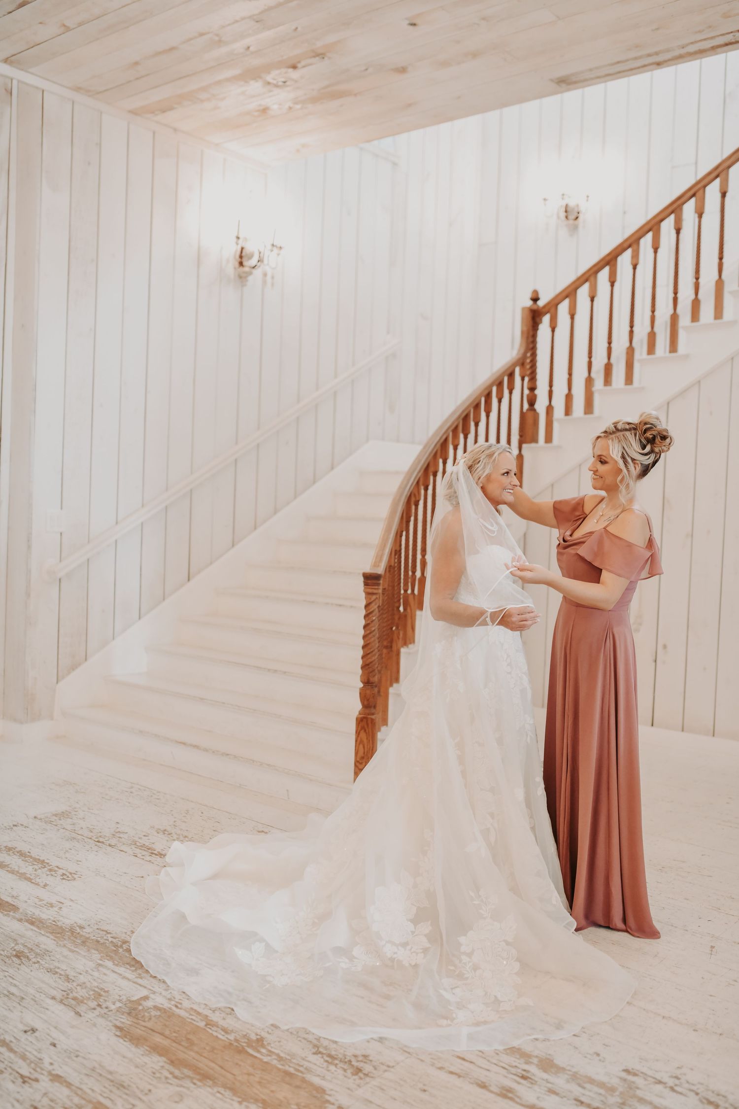 Elegant staircase bridal portraits at The White Sparrow wedding venue