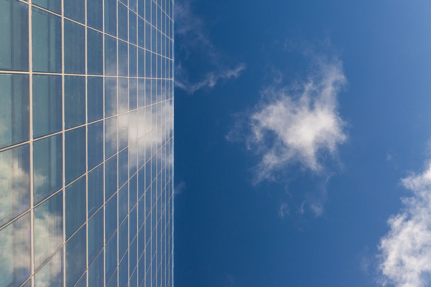 Glass façade and architectural details of 103 Colmore Row Birmingham
