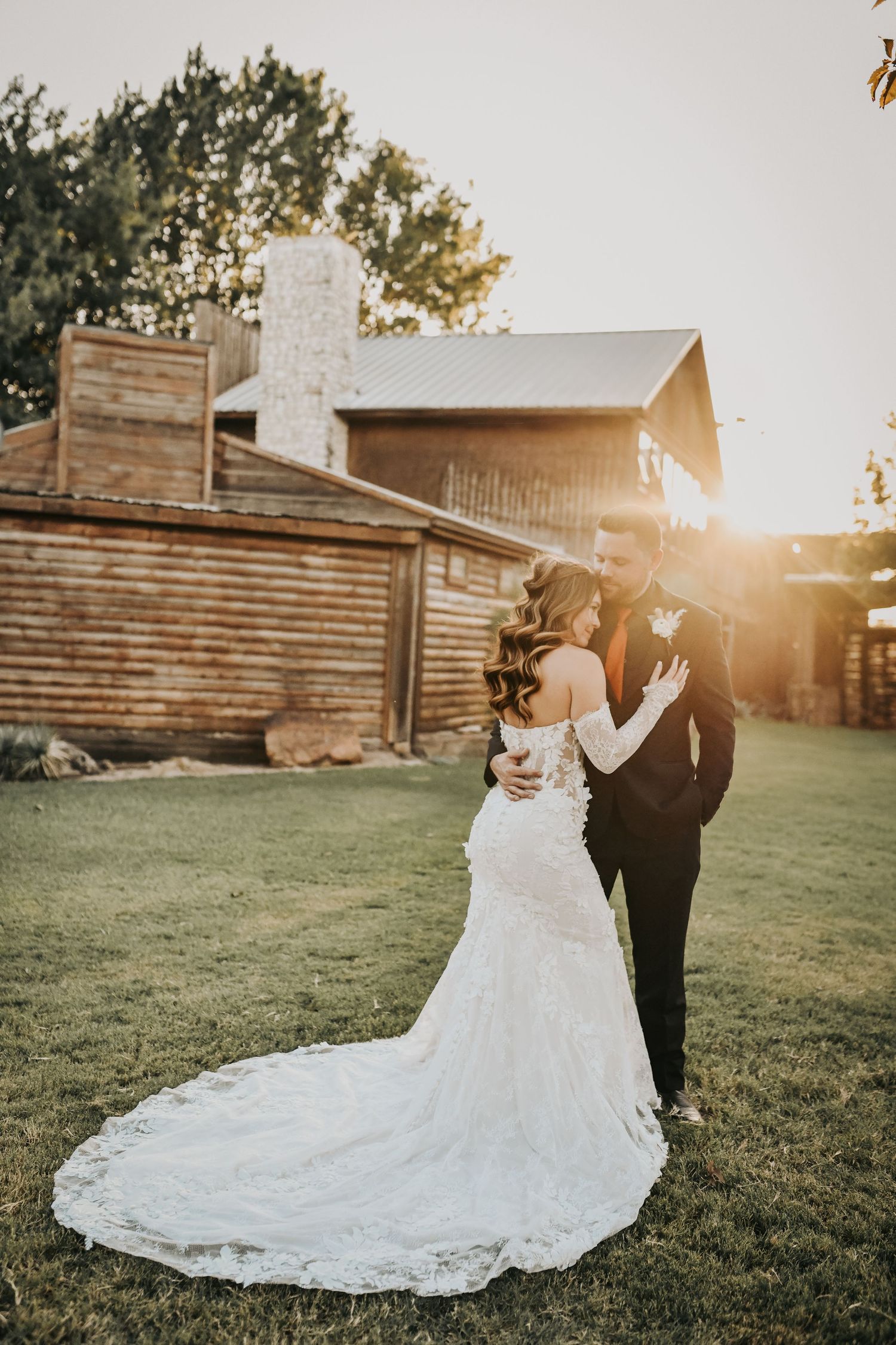 Bride and groom surrounded by the Texas ranch landscape
