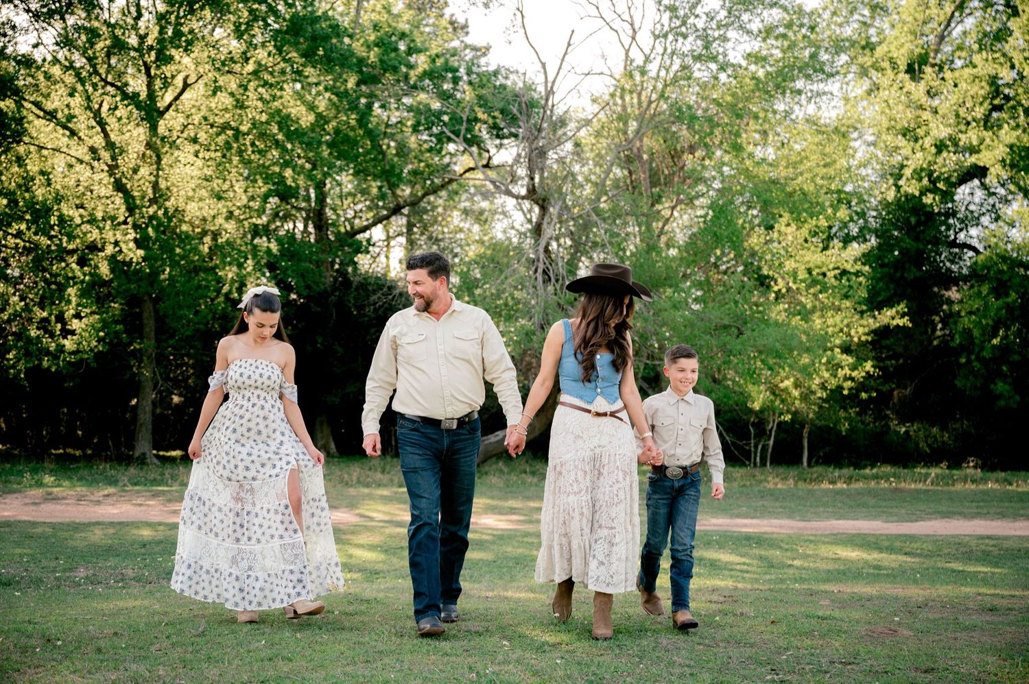 Natural family portrait surrounded by the countryside scenery and rustic charm of Good Vibes Farm in Tomball, Texas.