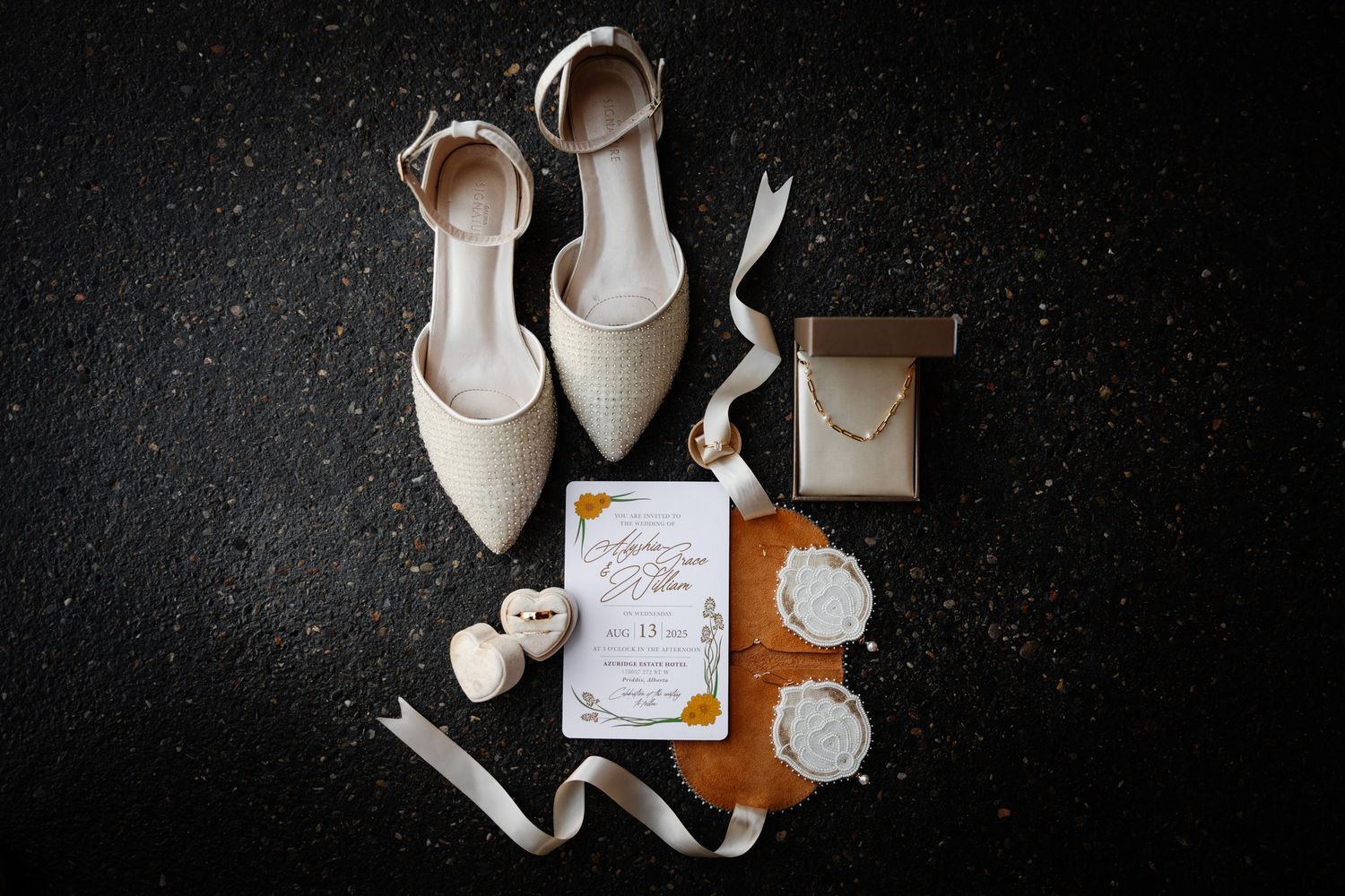 Wedding flat lay with ivory heels and invitation at Azuridge Estate Hotel