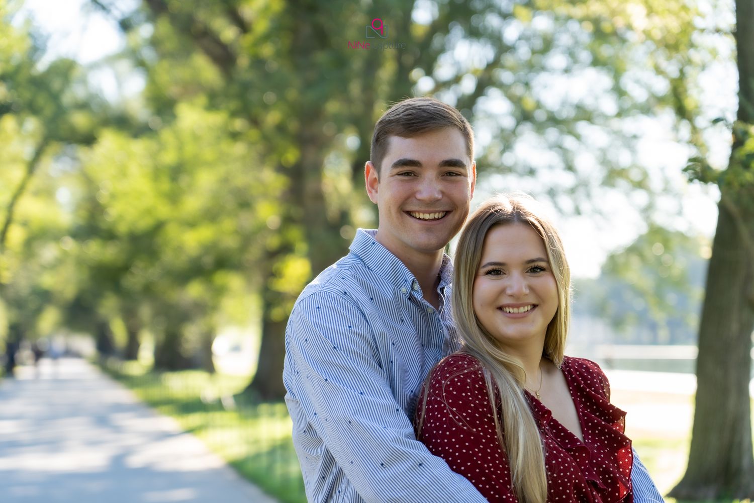 Young caucasian couple looking at each other in the Lincoln Memorial for a photoshoot