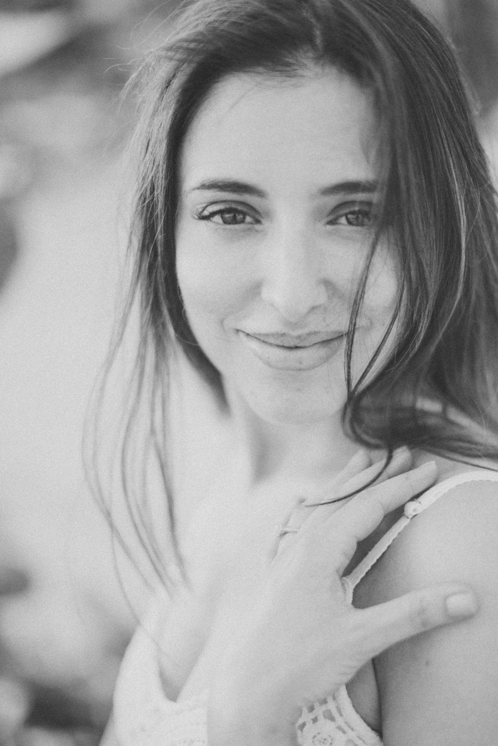 A black and white portrait showing soft natural lighting and delicate features.