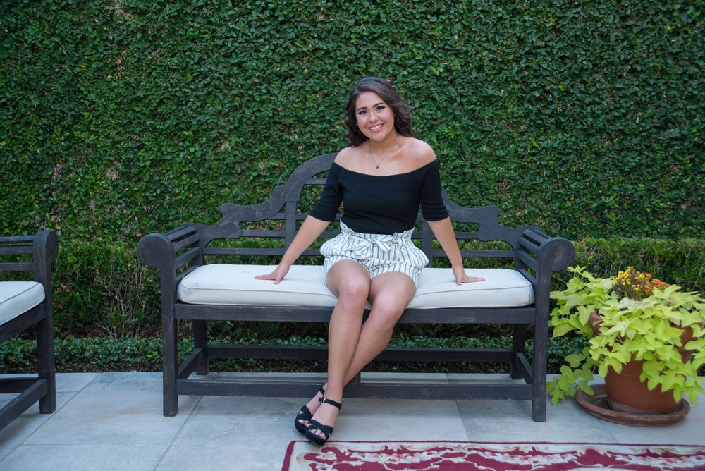 girl sitting on bench for a photo. Casa Polonia. Weslaco, Texas. Wedding photography