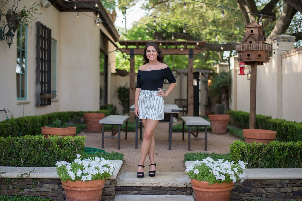girl standing up for a photo. Casa Polonia. Weslaco, Texas. Wedding photography