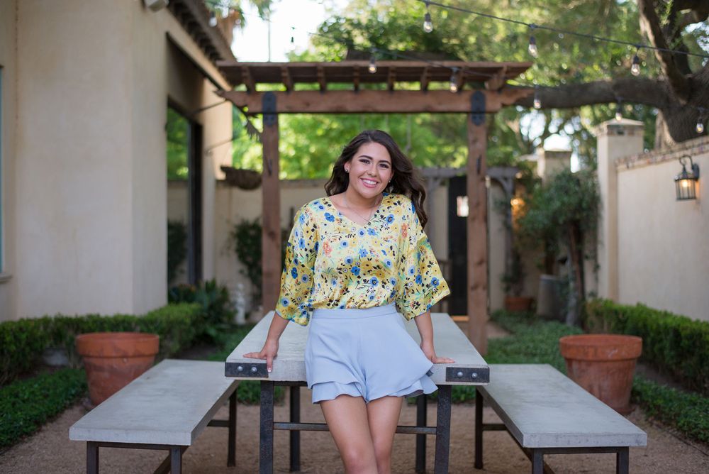 girl leaning on a table. Casa Polonia. Weslaco, Texas. Wedding photography