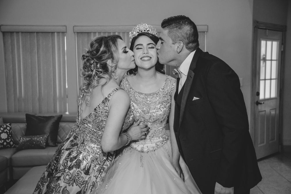 father and mother kissing daughter. Corinthian Event Center. Mission, Texas. Wedding photography