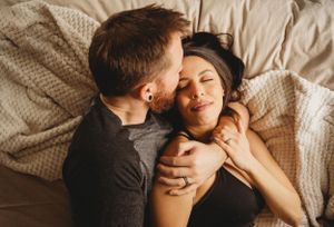 Intimate moment captured in natural light with gentle expressions.