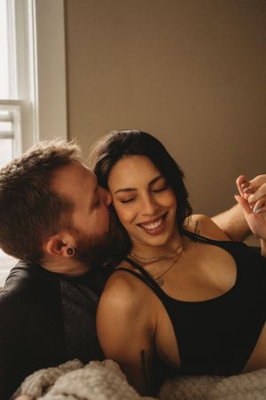 Intimate portrait with natural window lighting and genuine expressions.
