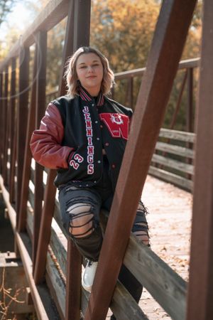 girl senior pictures at bridge