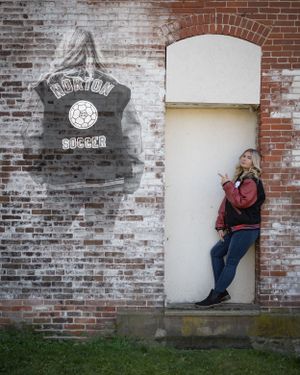 girl senior pictures with letterman jacket