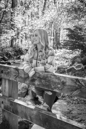 girl senior pictures at covered bridge