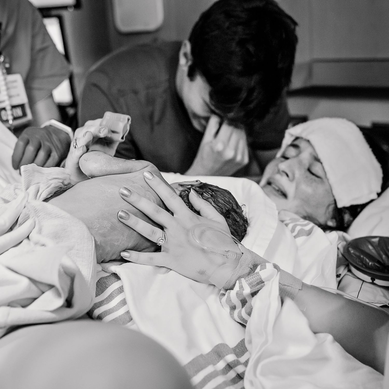 newborn baby girl just delivered laying on moms chest at Saint francis in tulsa