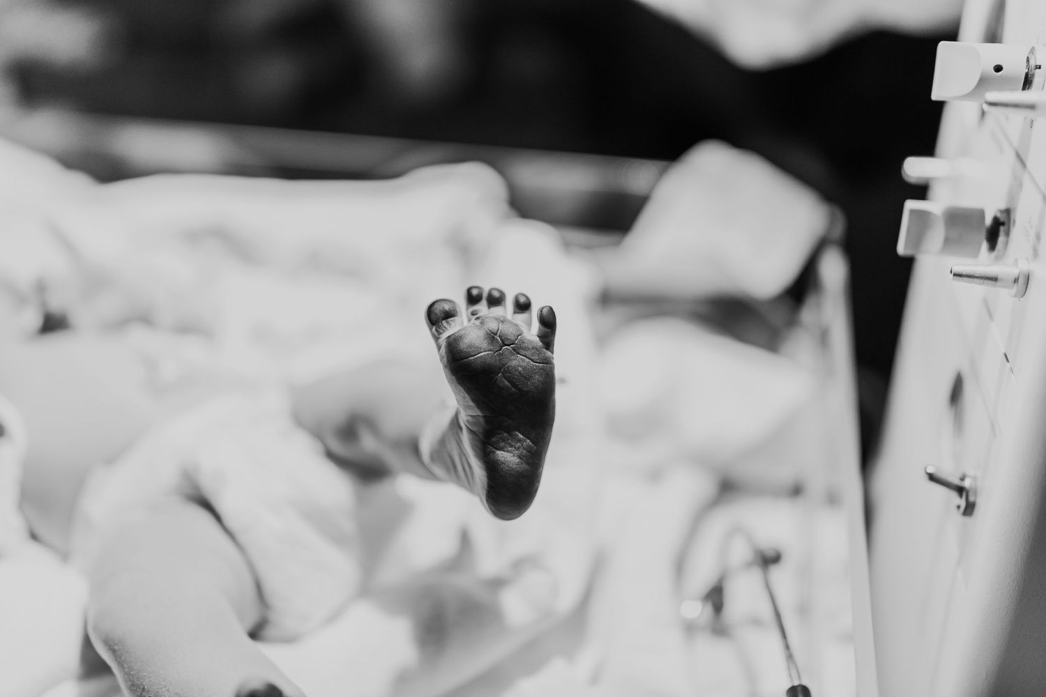 newborn baby girls foot with ink on it her birth documented in Tulsa,OK