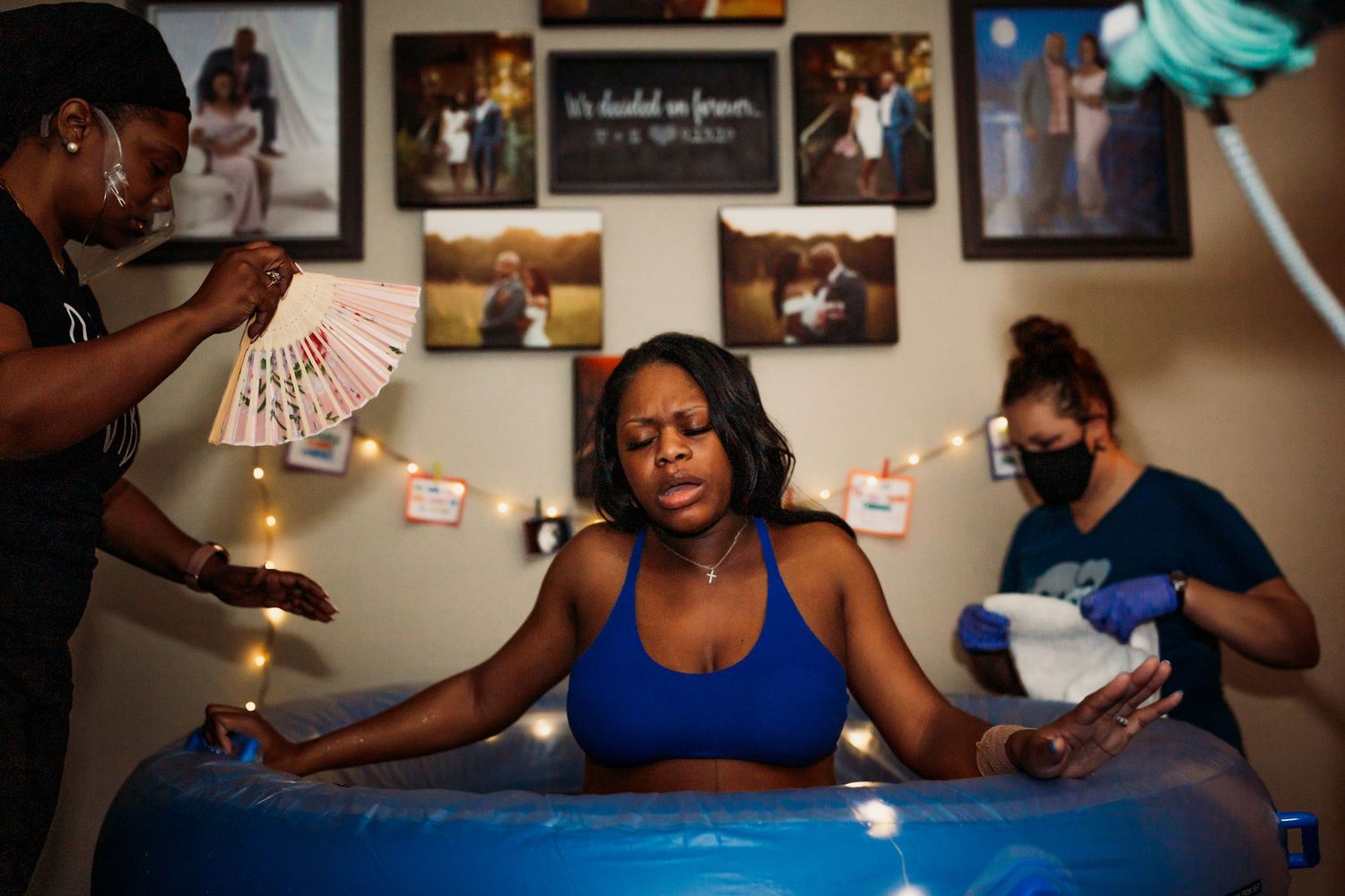 mom having a contraction in birthing pool at her home in Tulsa,ok