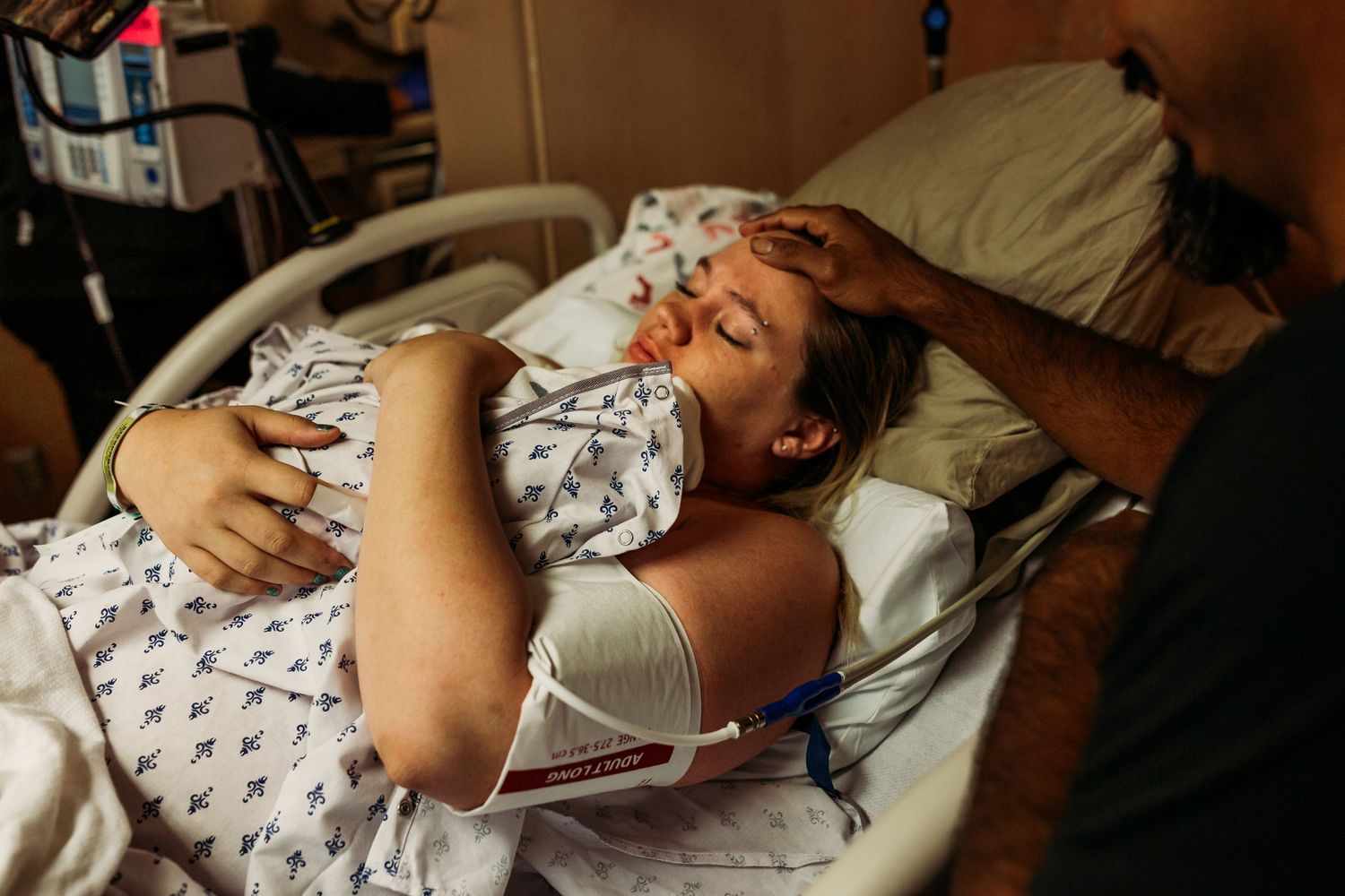 Tulsa birth photographer newborn snuggles after birth