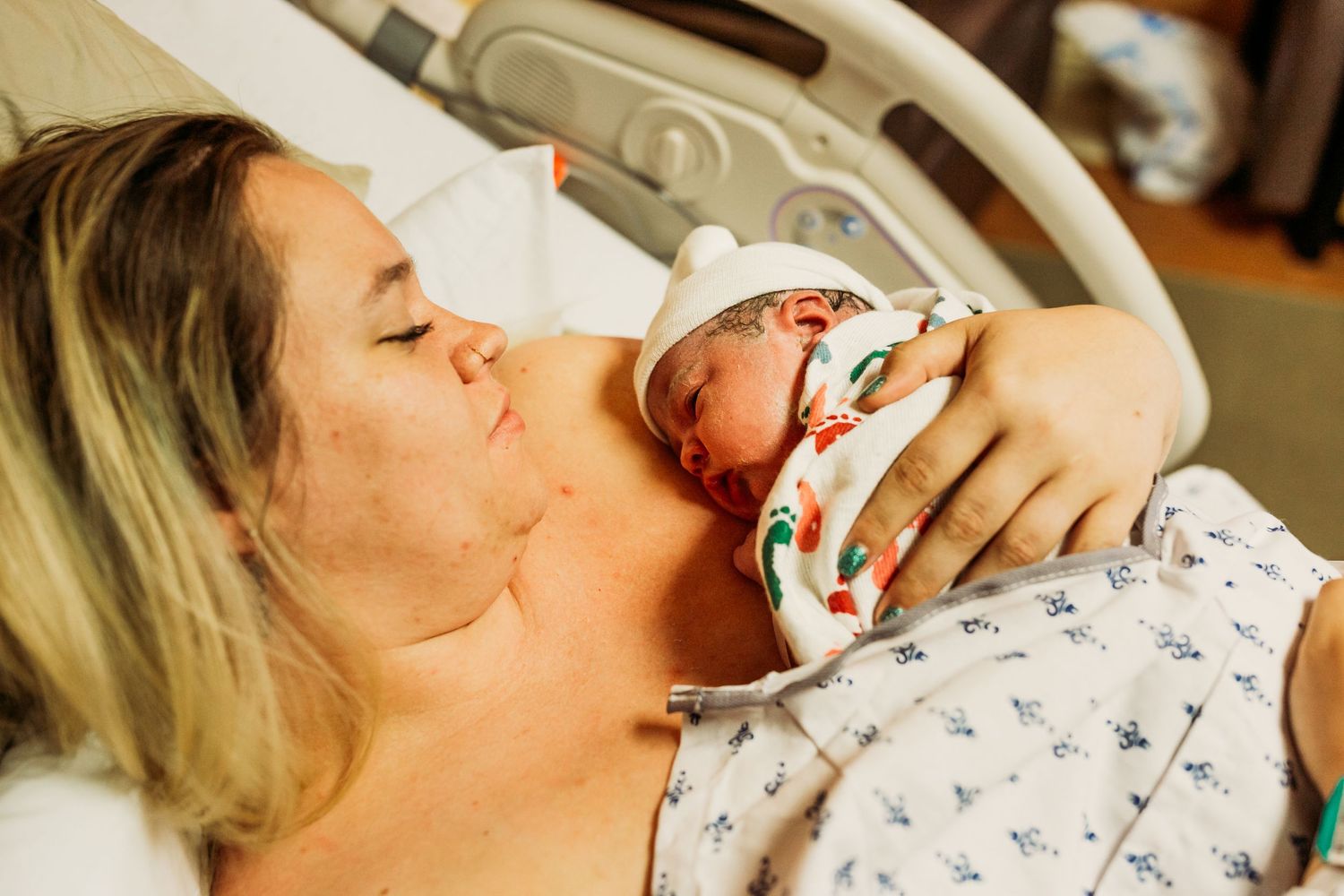 newborn baby girl looking at her mom moments after birth in tulsa,ok