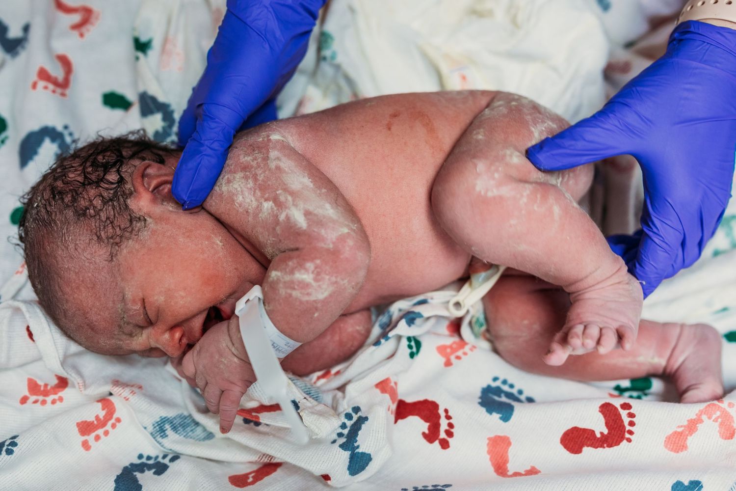 Tulsa birth photographer newborn baby girl just born at St.John Hospital in tulsa, ok