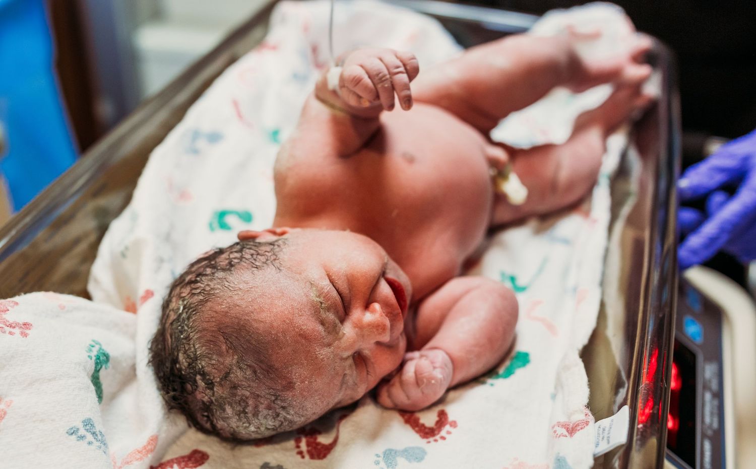 newborn baby getting weighed right after birth in tulsa, OK