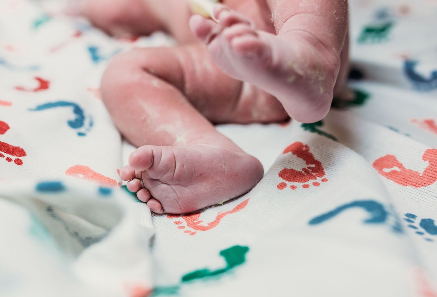 Tulsa birth photographer newborn baby boy footprints postpartum