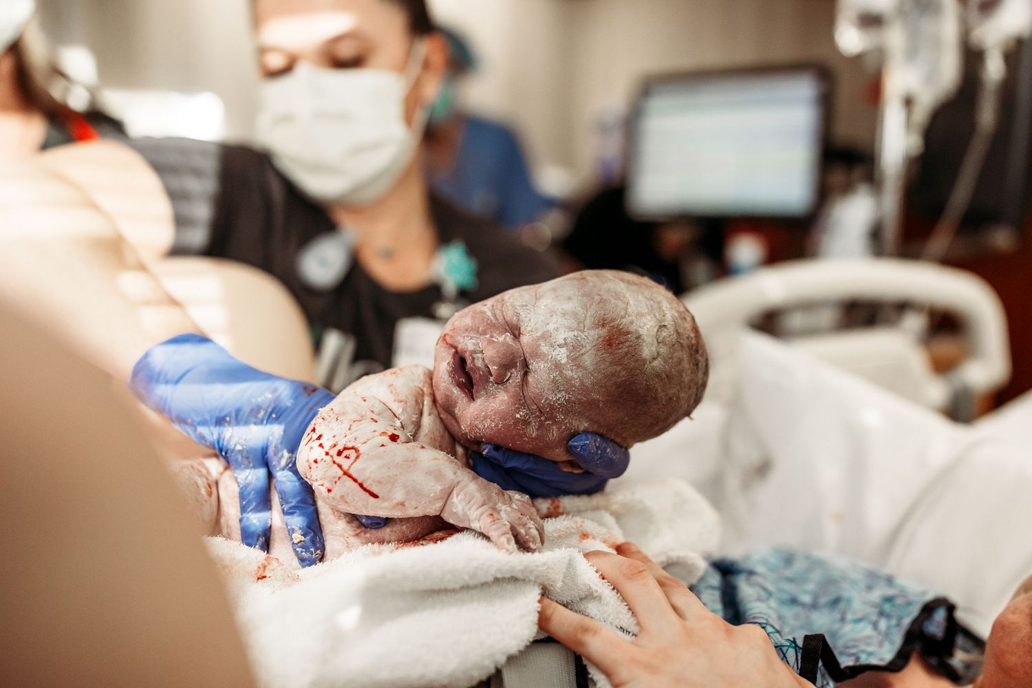 newborn baby just delivered her birth captured at Hillcrest hospital in Tulsa