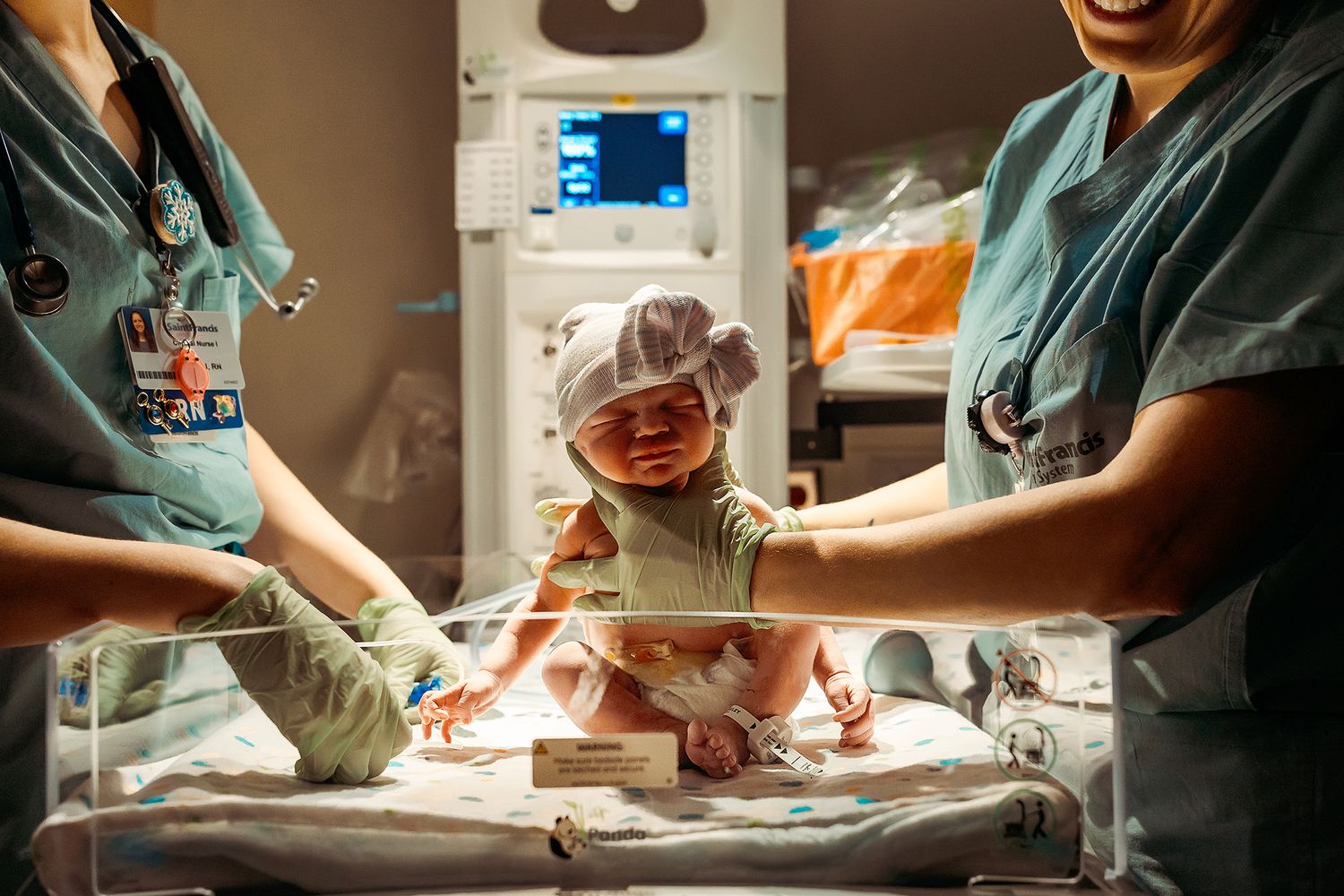 Newborn baby girl moments after birth being check out by nicu at Saint Francis Hospital in Tulsa,OK.