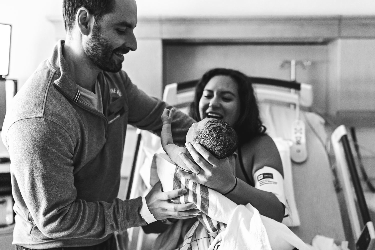 dad holding his newborn son for the first time