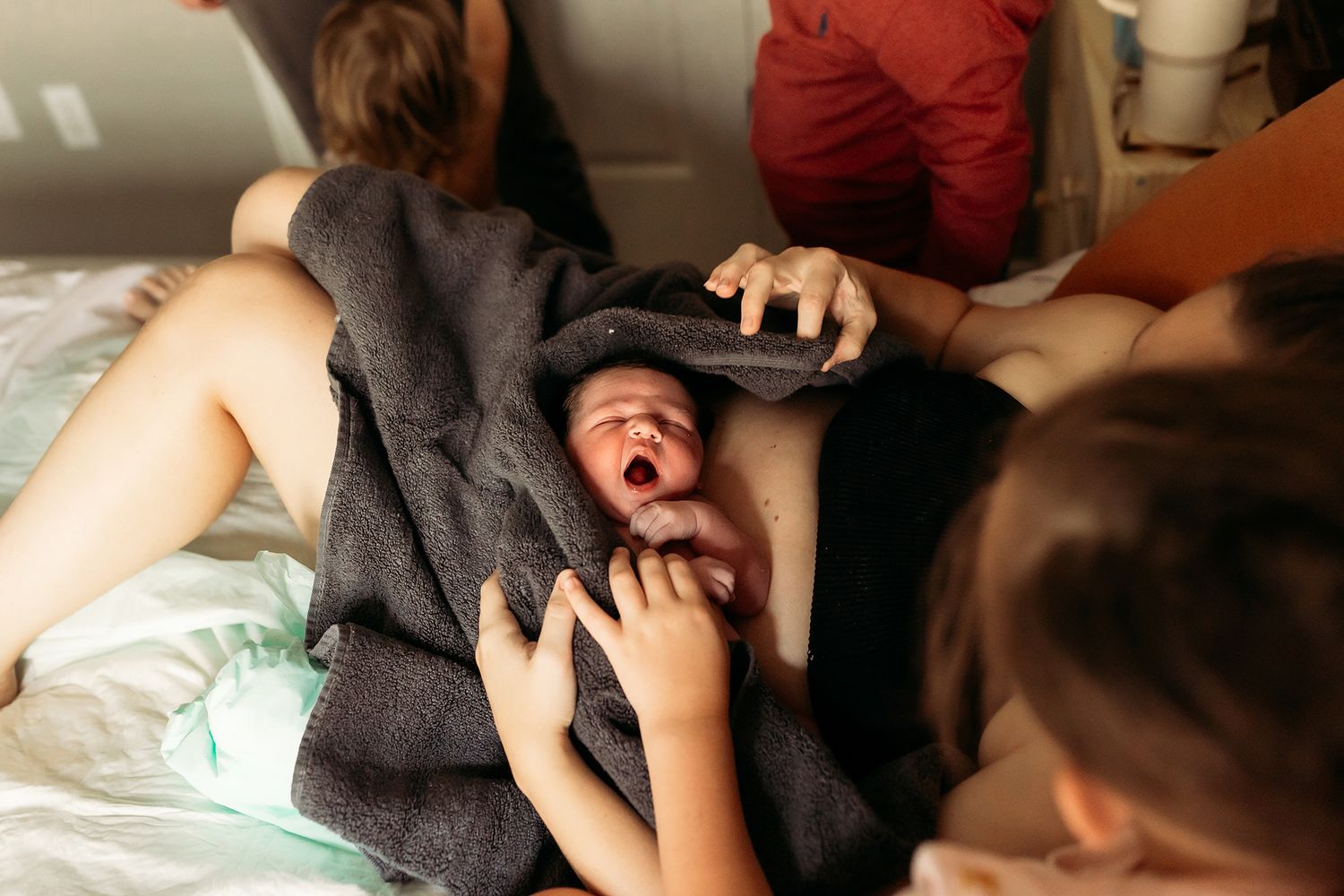 newborn-baby-laying-on-mom-right-after-home-birth-in-tulsa-ok