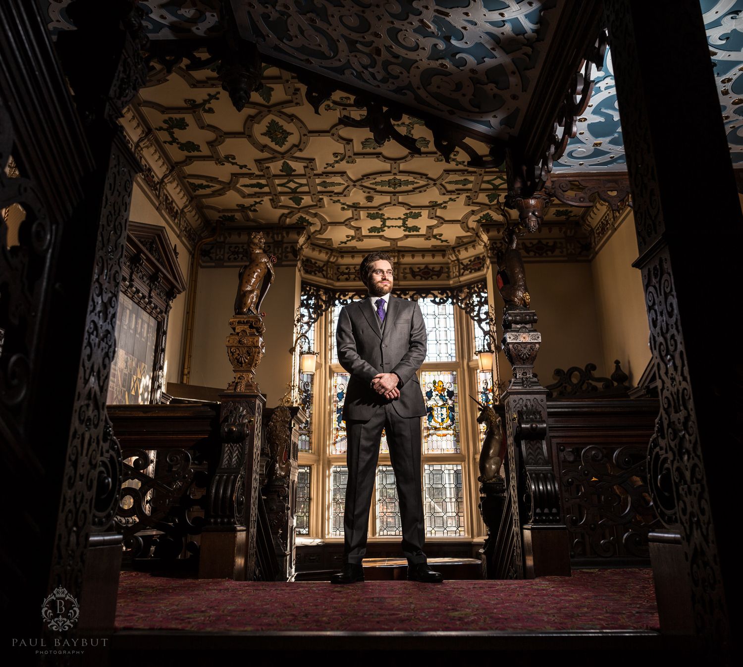 A dramatic silhouette in an ornately decorated gothic doorway.