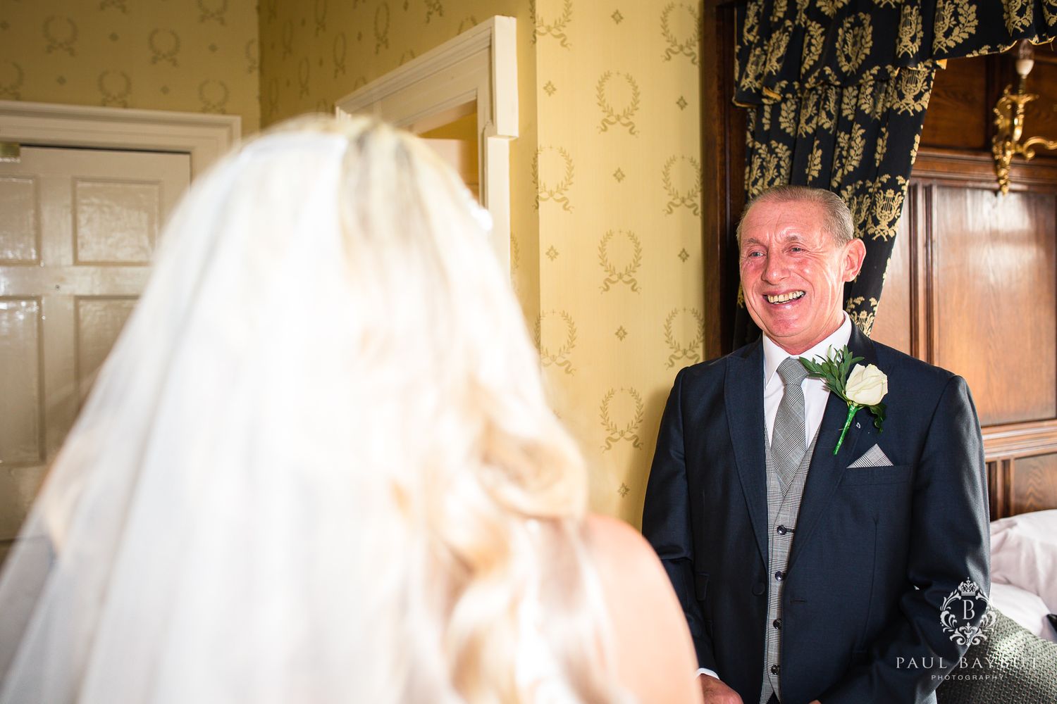 Heartwarming first look reaction in a classic hotel setting.