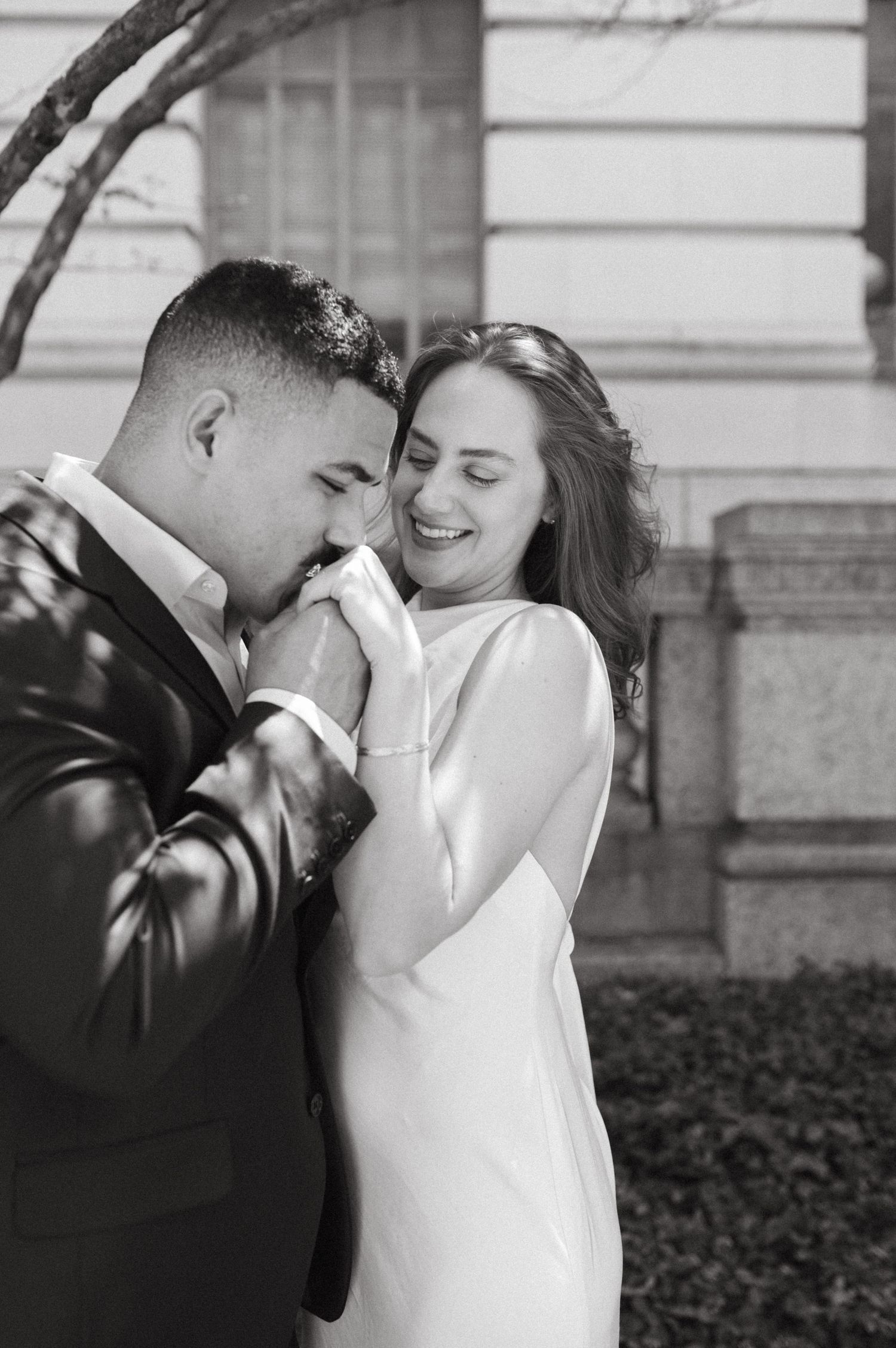 A tender black and white moment between a couple sharing an intimate pose.