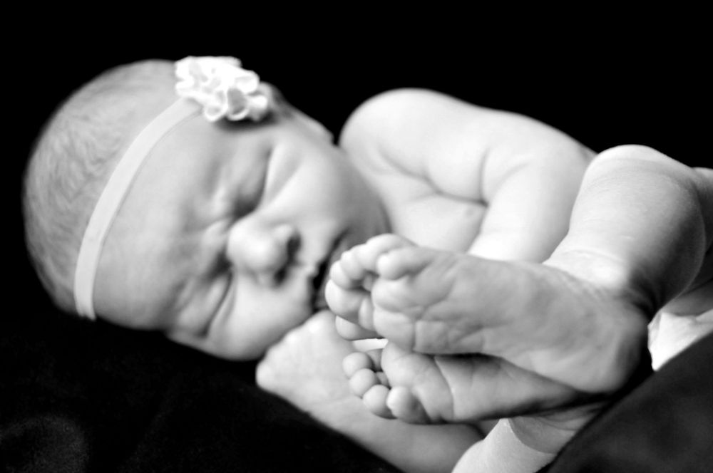 black and white photo of newborn baby girl