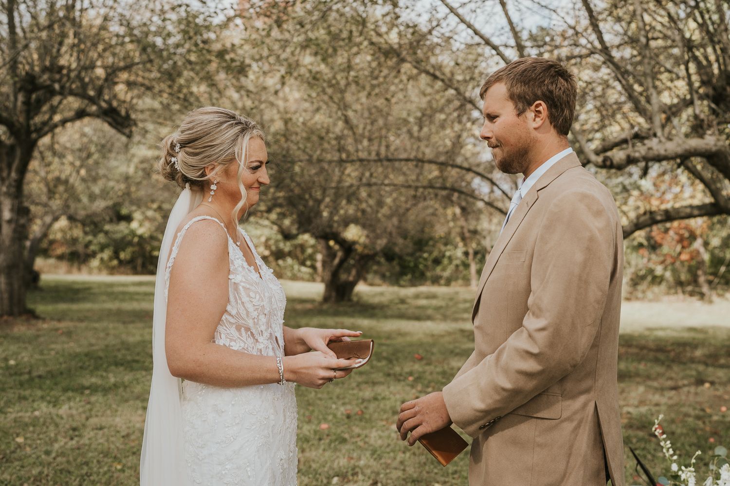 Romantic first look sequence between newlyweds in a rustic outdoor setting taken by Jackson Michigan photographer.