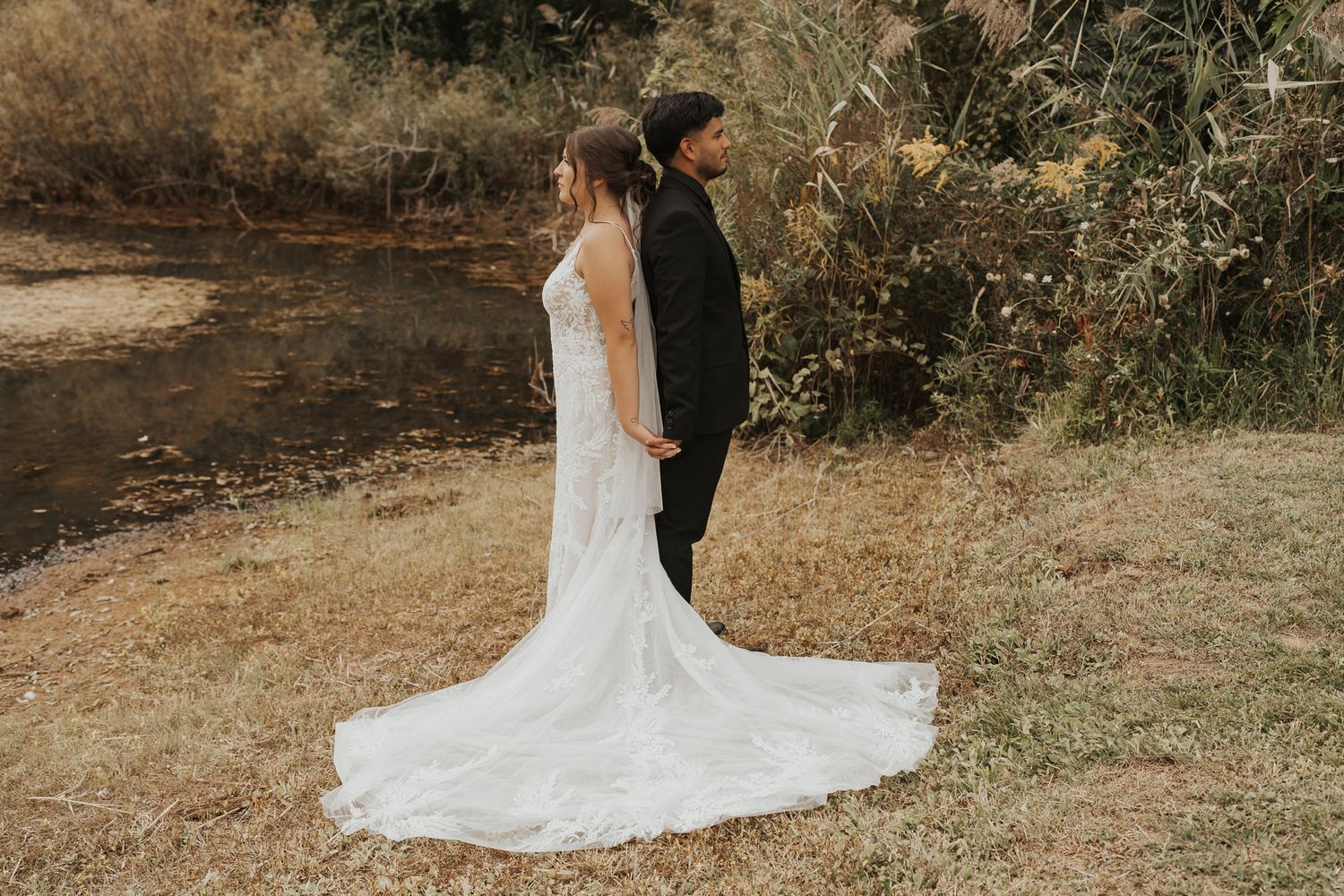 A romantic wedding photo series showing a couple posing together in a rustic outdoor setting with a train in the background.
