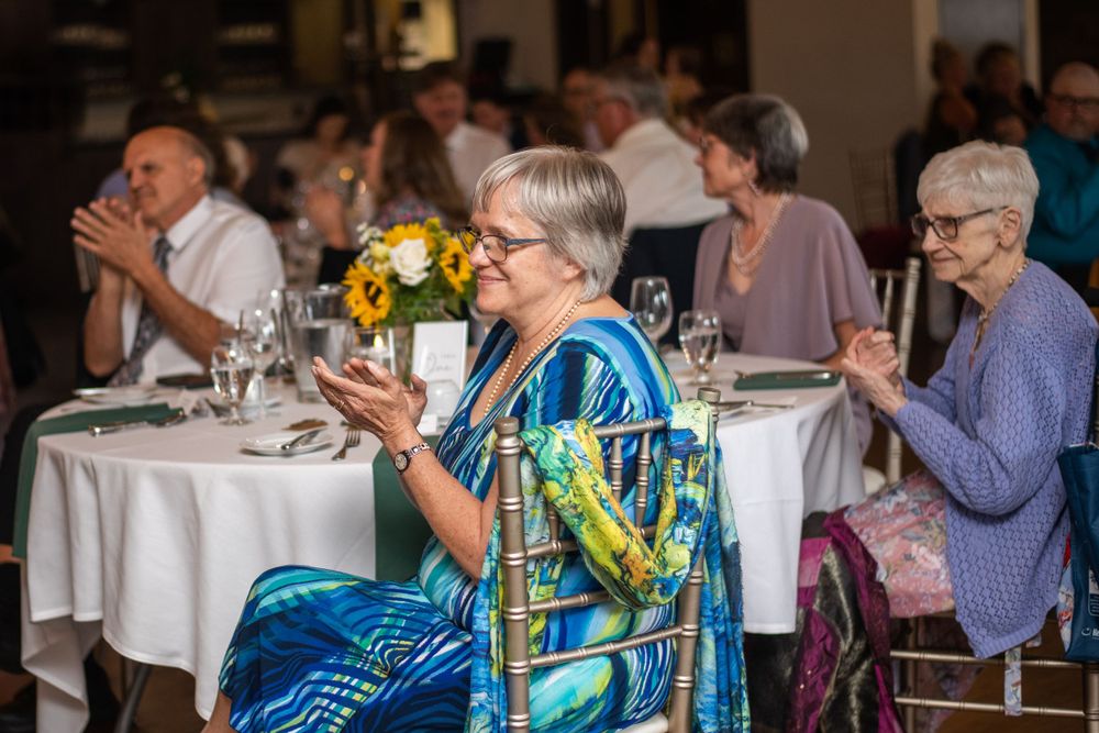 Guest clapping candid wedding reception at Stratford Country Club