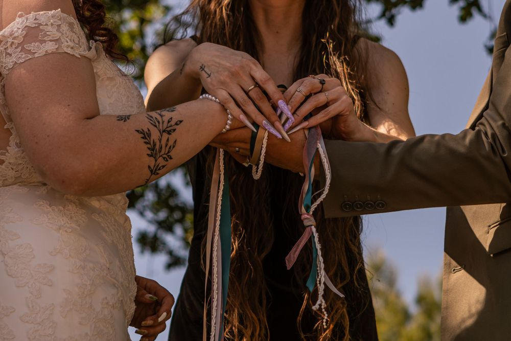 A handfasting ceremony is done as a couple recommits themselves in front of their loved ones.