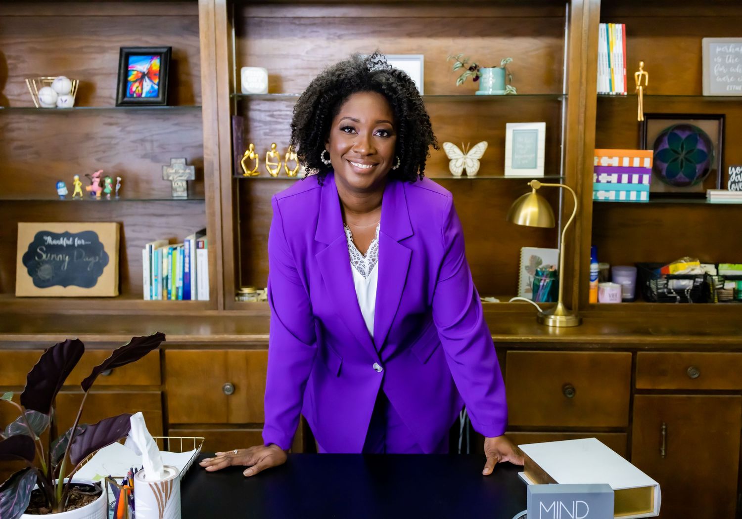A professional solo portrait of a woman exuding confidence and determination at her office in Jacksonville, Alabama.