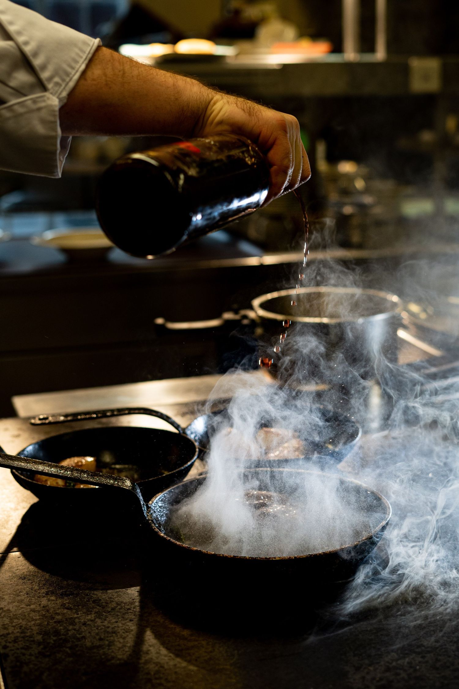 chef pouring wine Gloucestershire branding photography