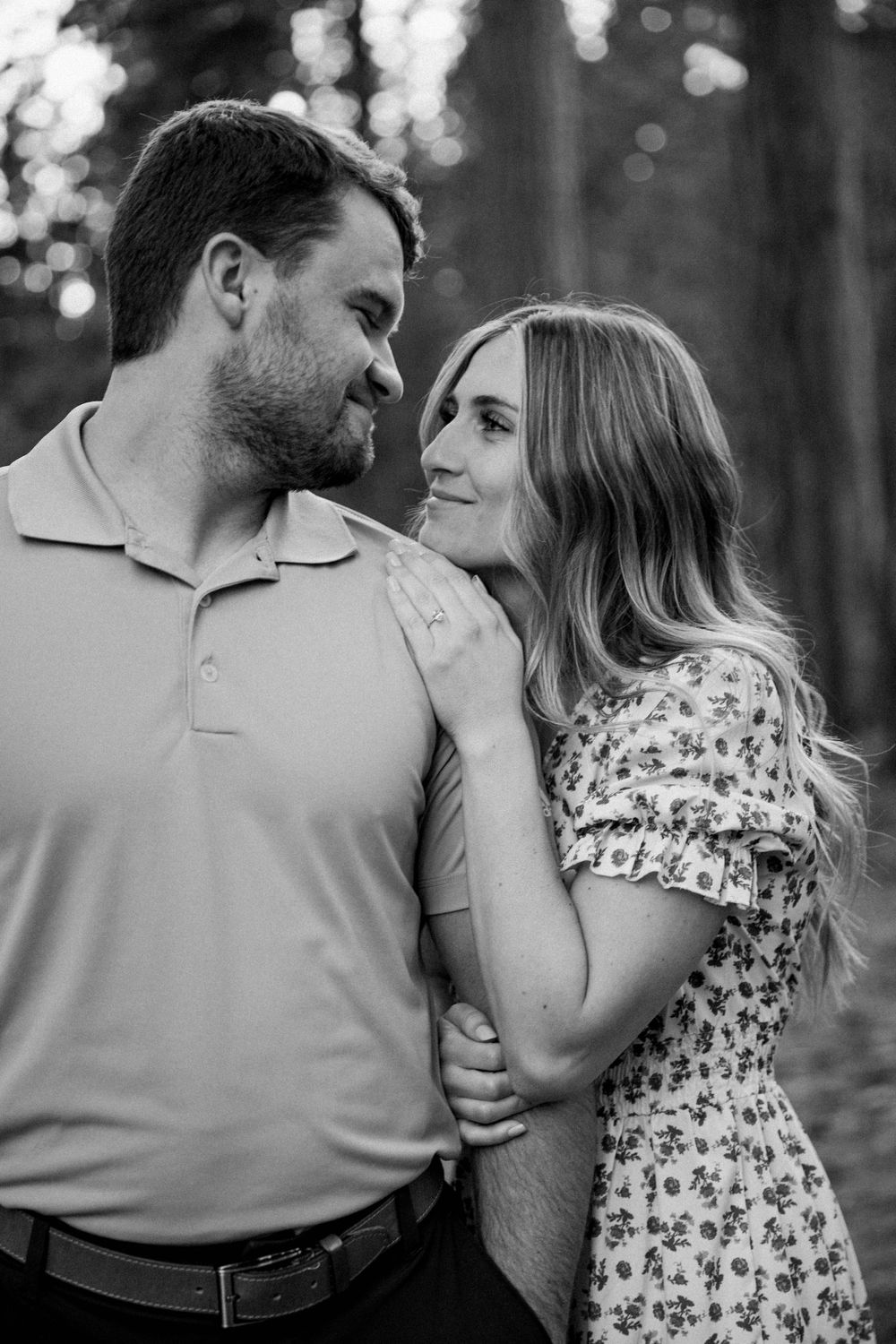 man and woman embrace  after getting engaged in Pinecrest, California