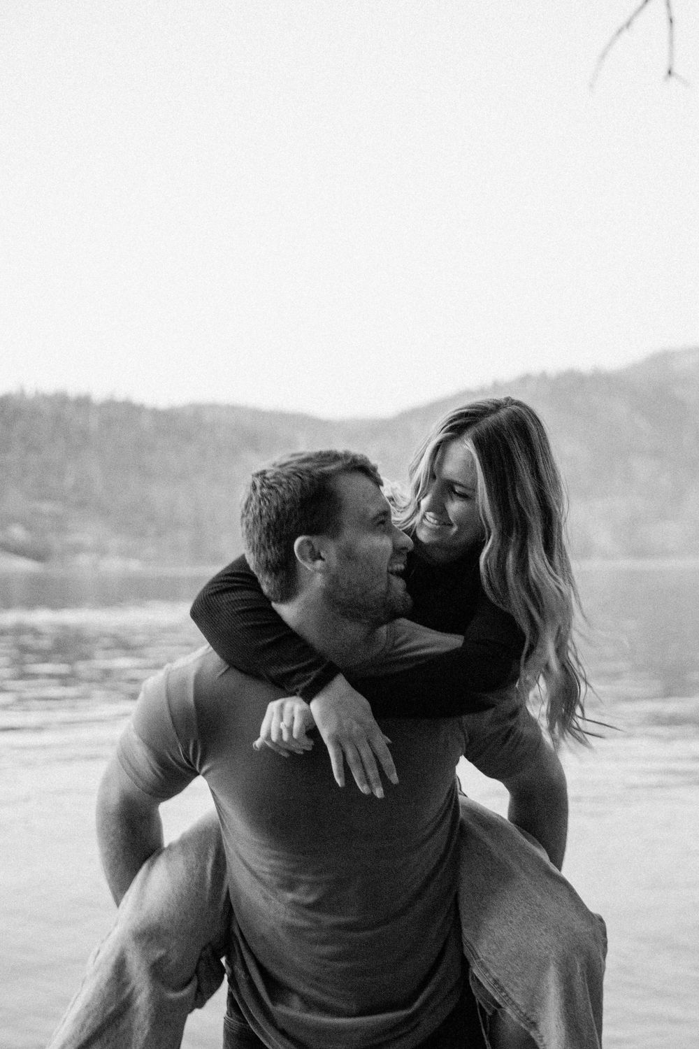 man and woman embrace  after getting engaged in Pinecrest, California