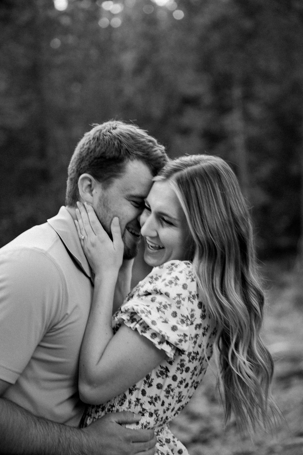 man and woman embrace  after getting engaged in Pinecrest, California