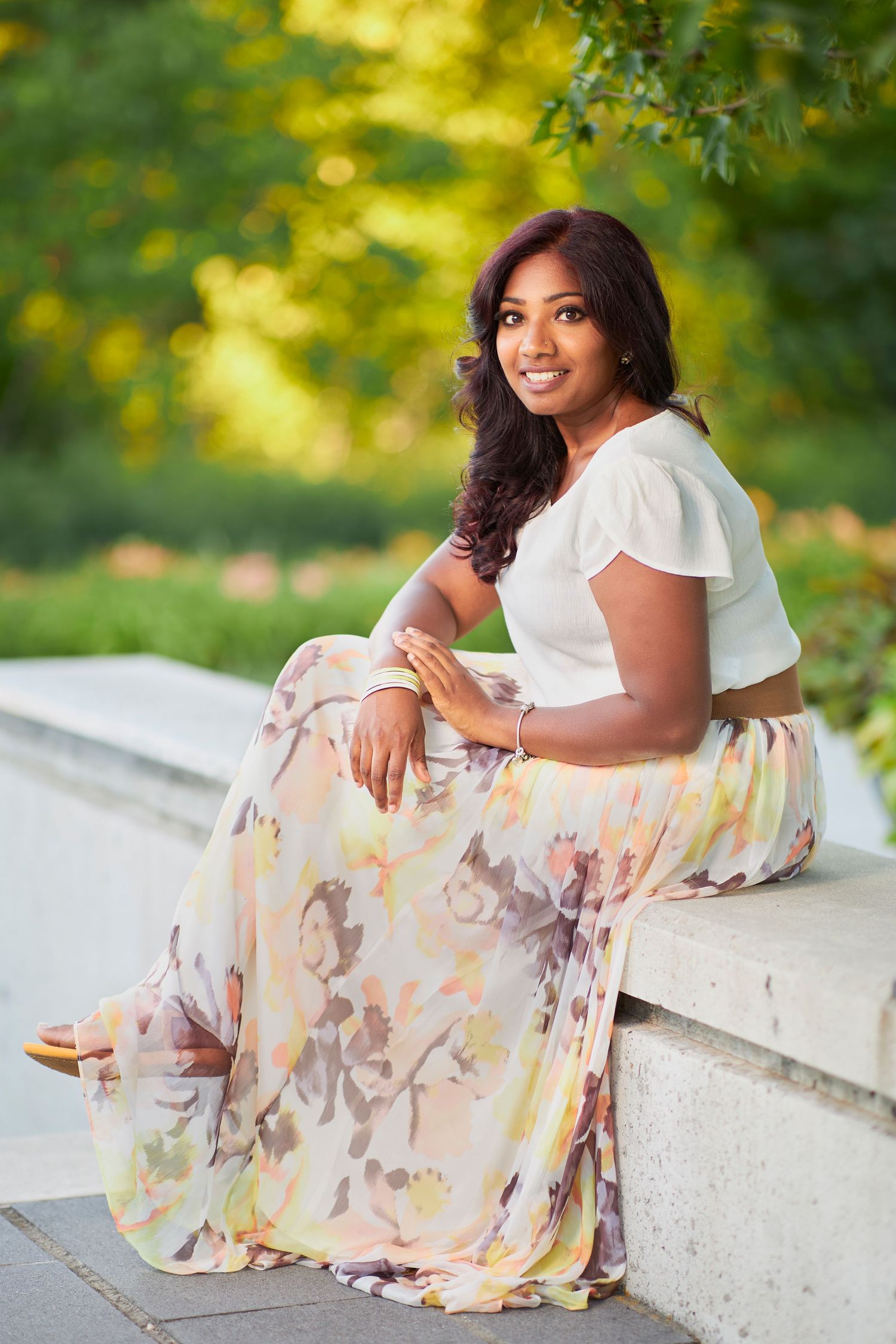 Portrait photography session in a natural outdoor setting with soft golden lighting.