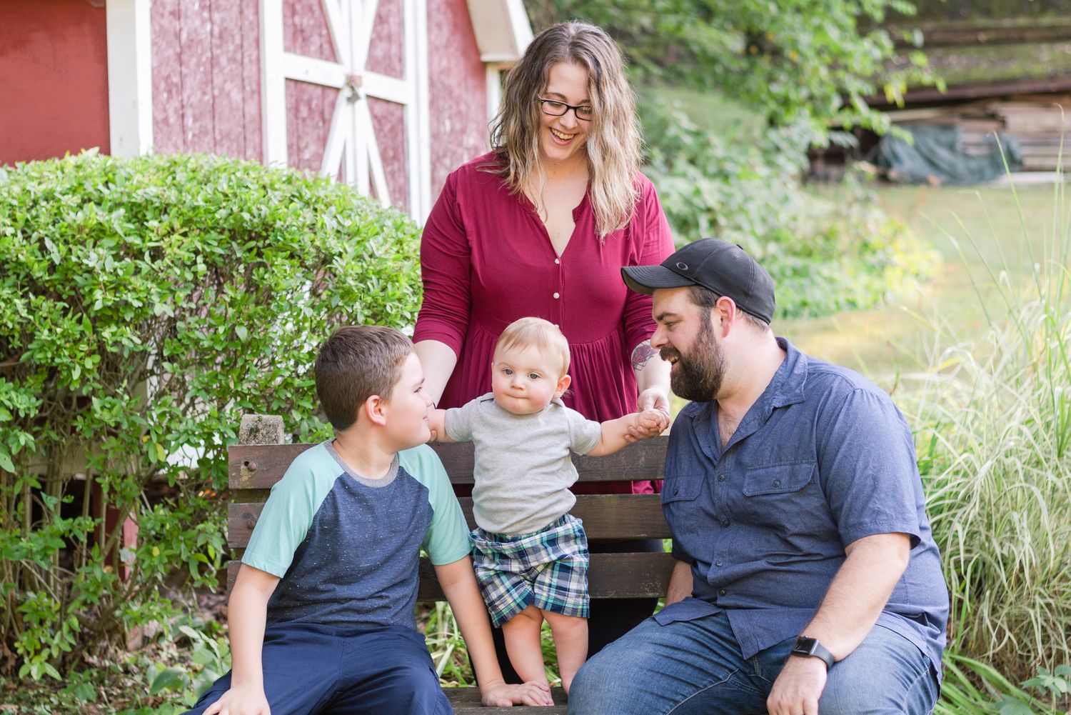 Family in front of red barn in Mars, Pennsylvania