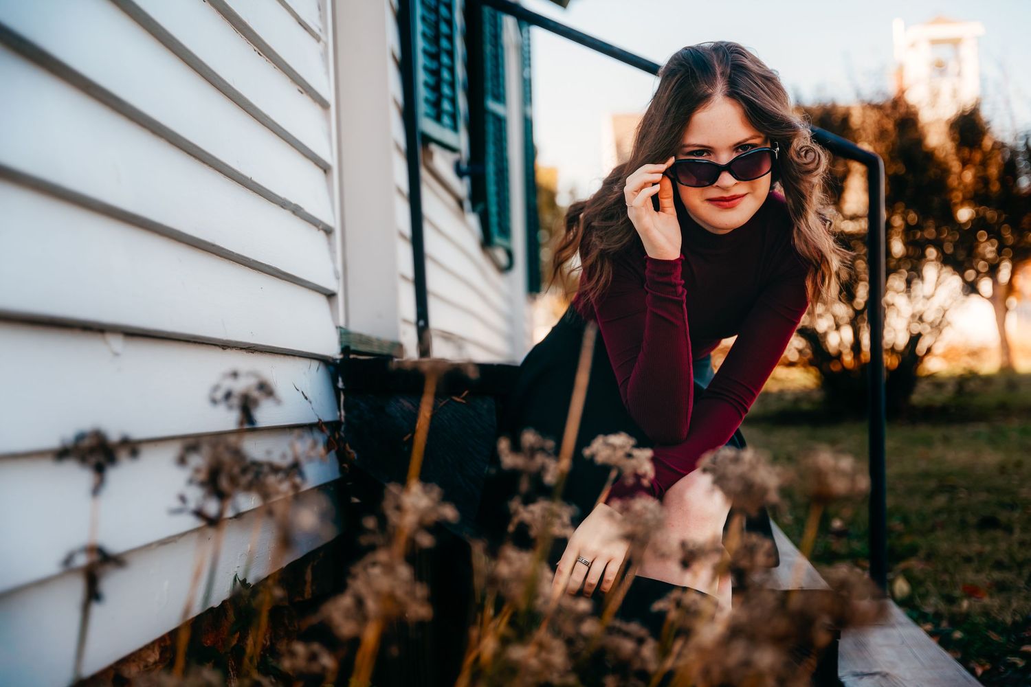 high school senior girl portrait sitting on stairs looking over sunglasses Nathaniel Greene Park