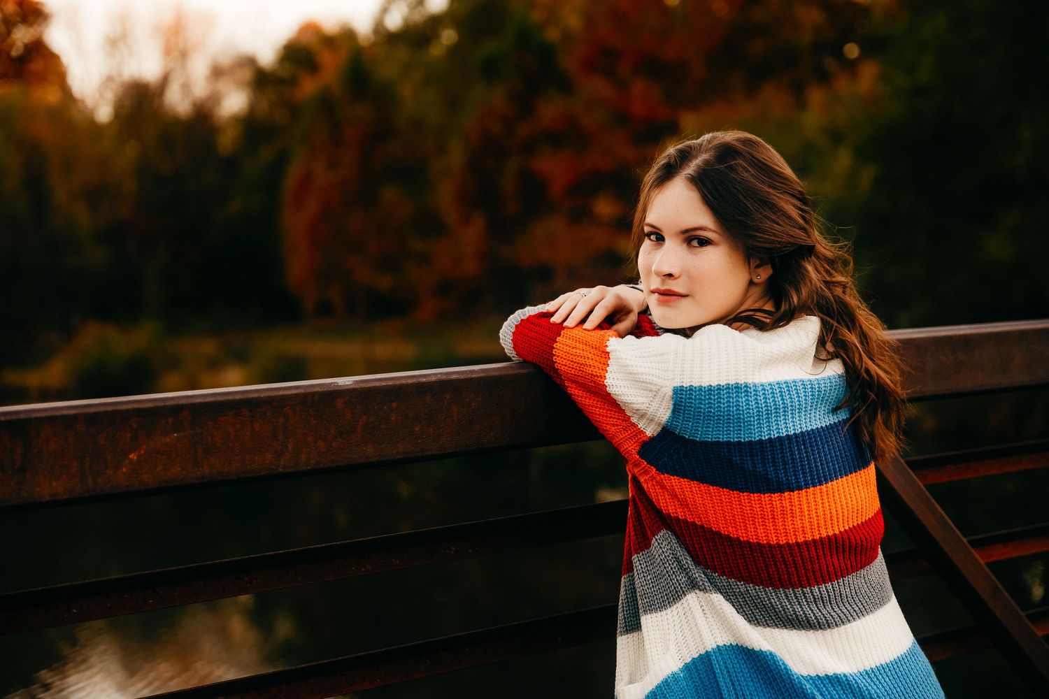 Senior girl portrait on bridge looking back