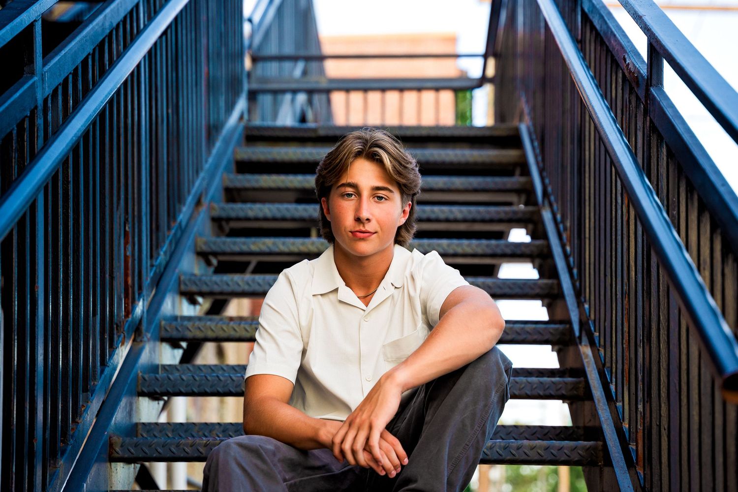 Senior Boy portrait sitting on stairs