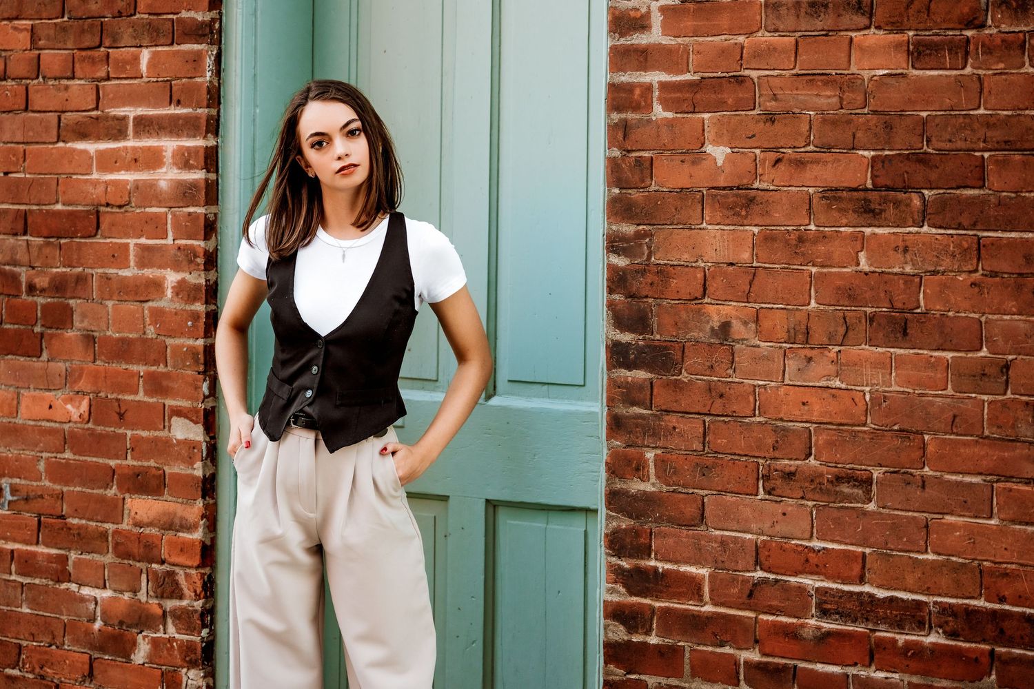 High School Senior Girl standing in front of doorway