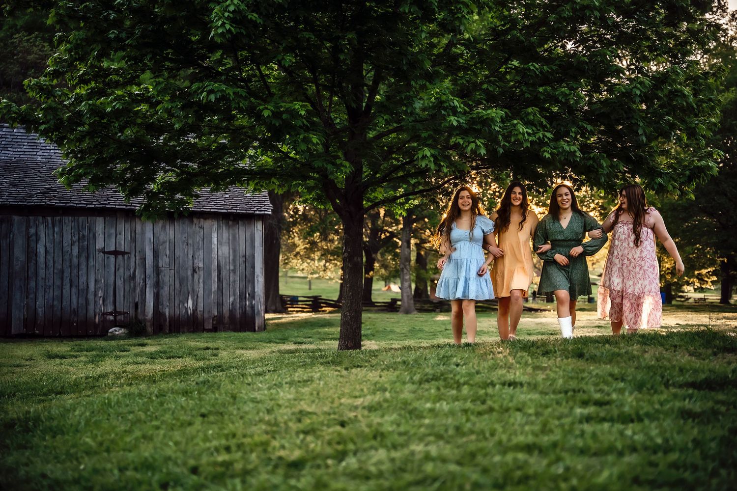 high school senior girls portrait walking arm and arm Nathaniel Greene Park